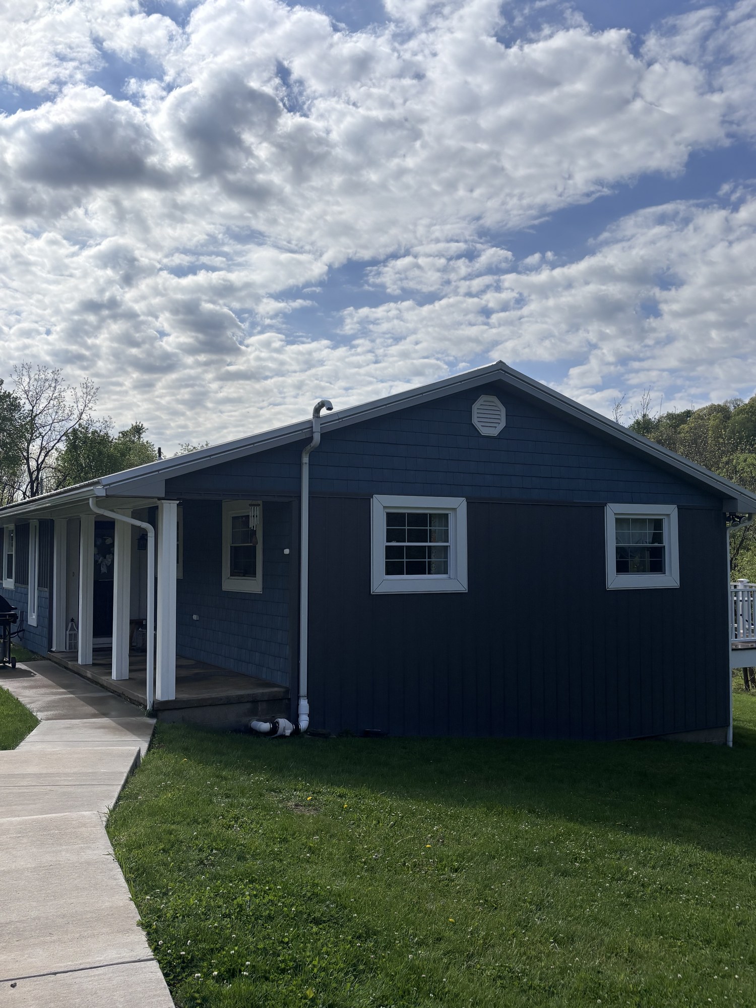 Dark siding two-story home after wash