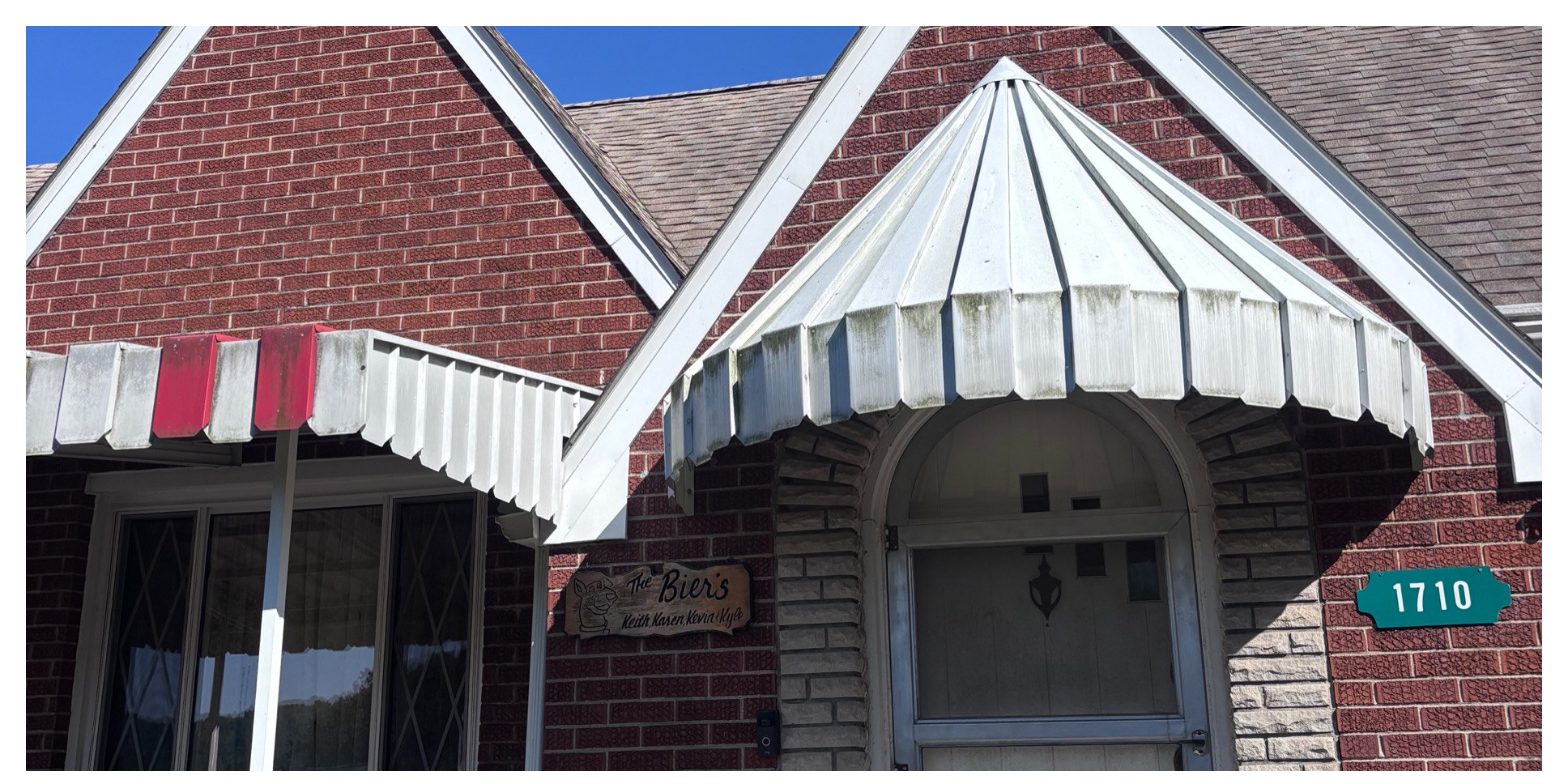 Front entry awning & brick detail before