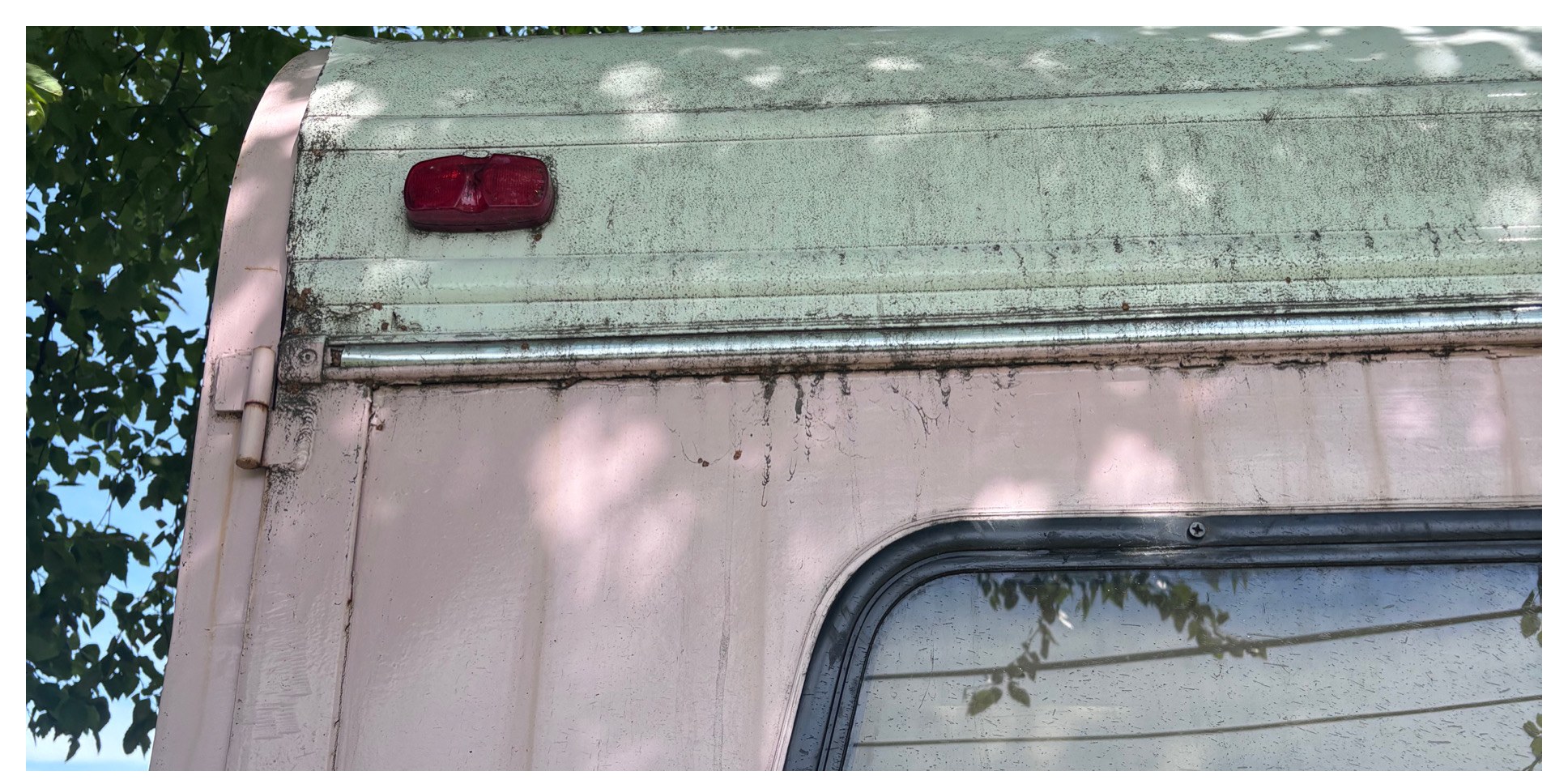 Camper roof edge cleaning before