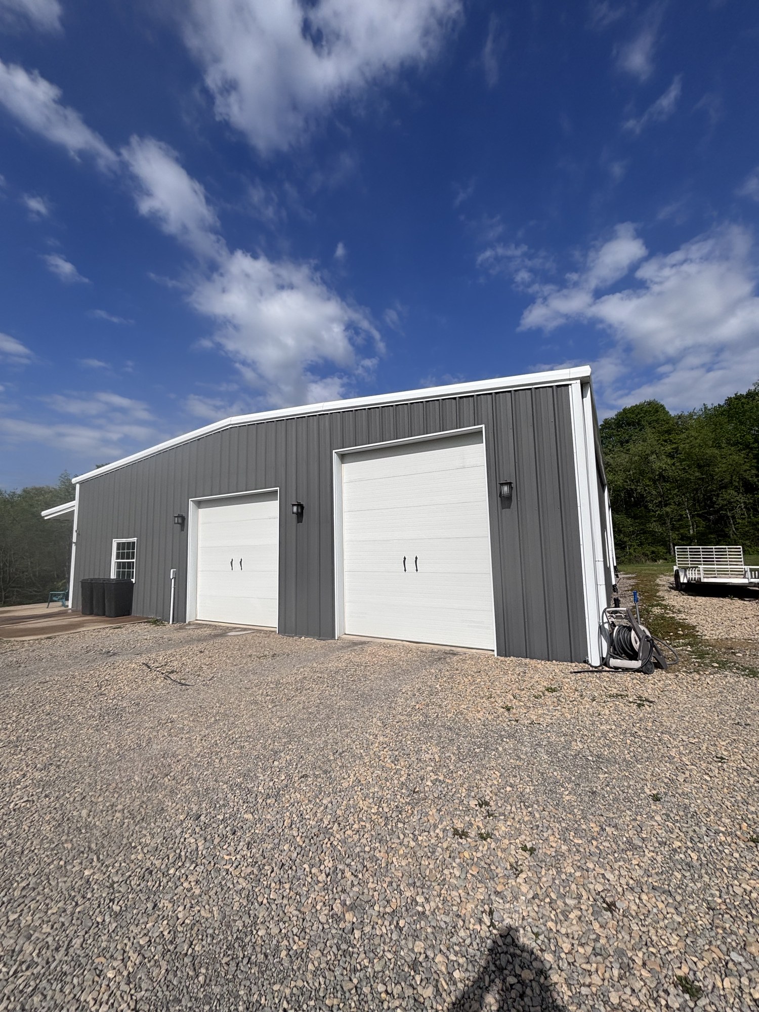 Metal pole barn after wash — garage doors